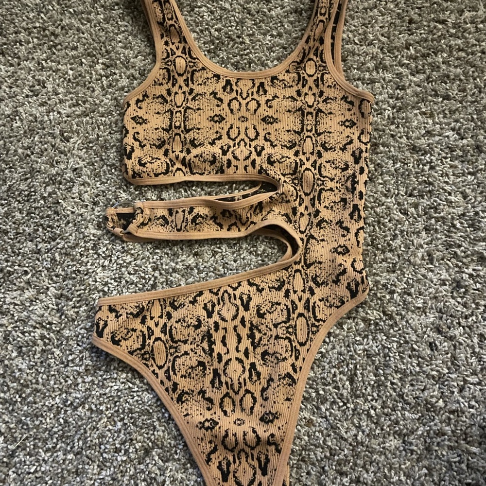 Woman’s cheetah print body suit